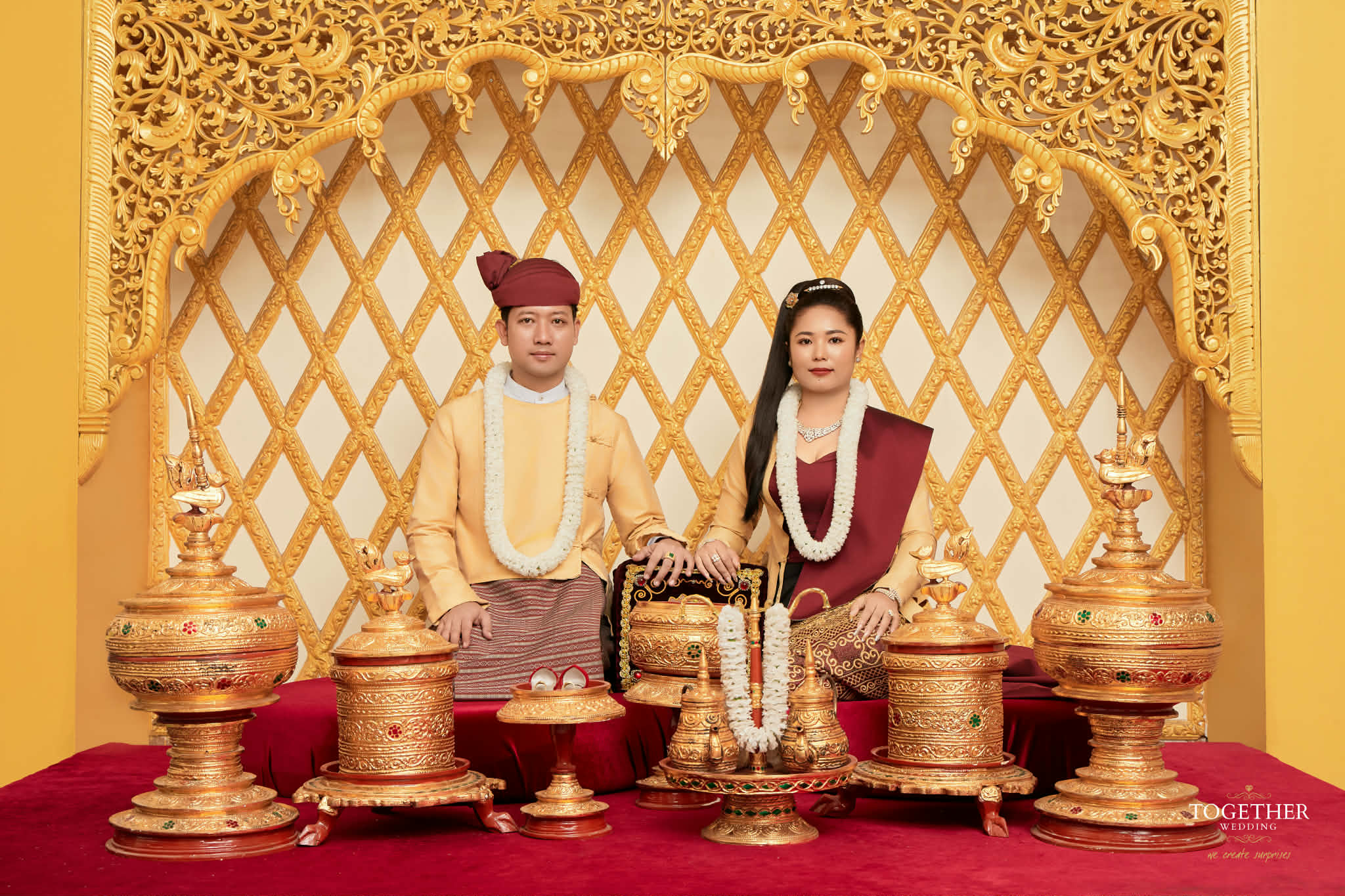 Ceremonial portrait with ornate Myanmar wedding details