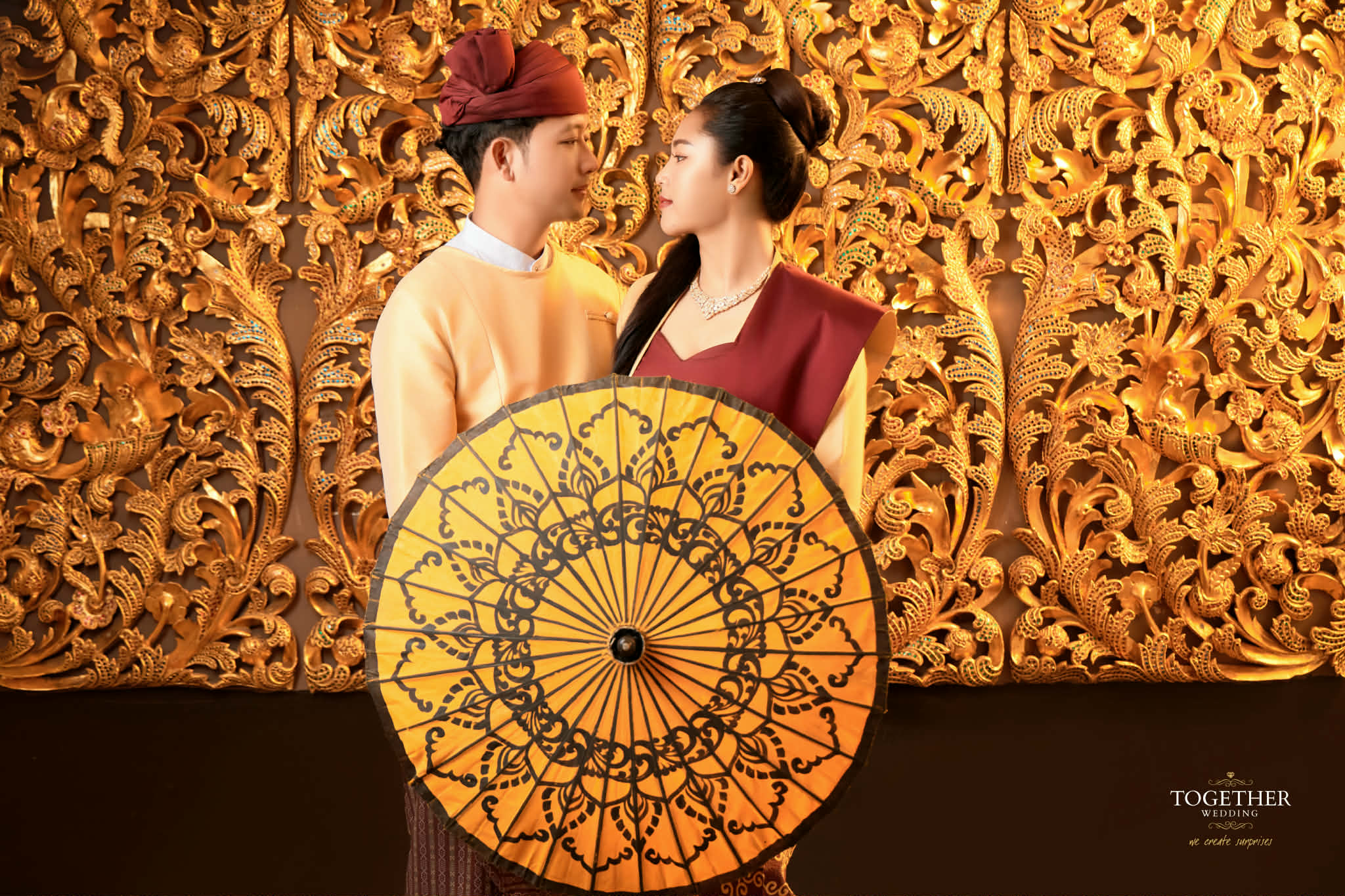 Romantic traditional portrait with golden umbrella